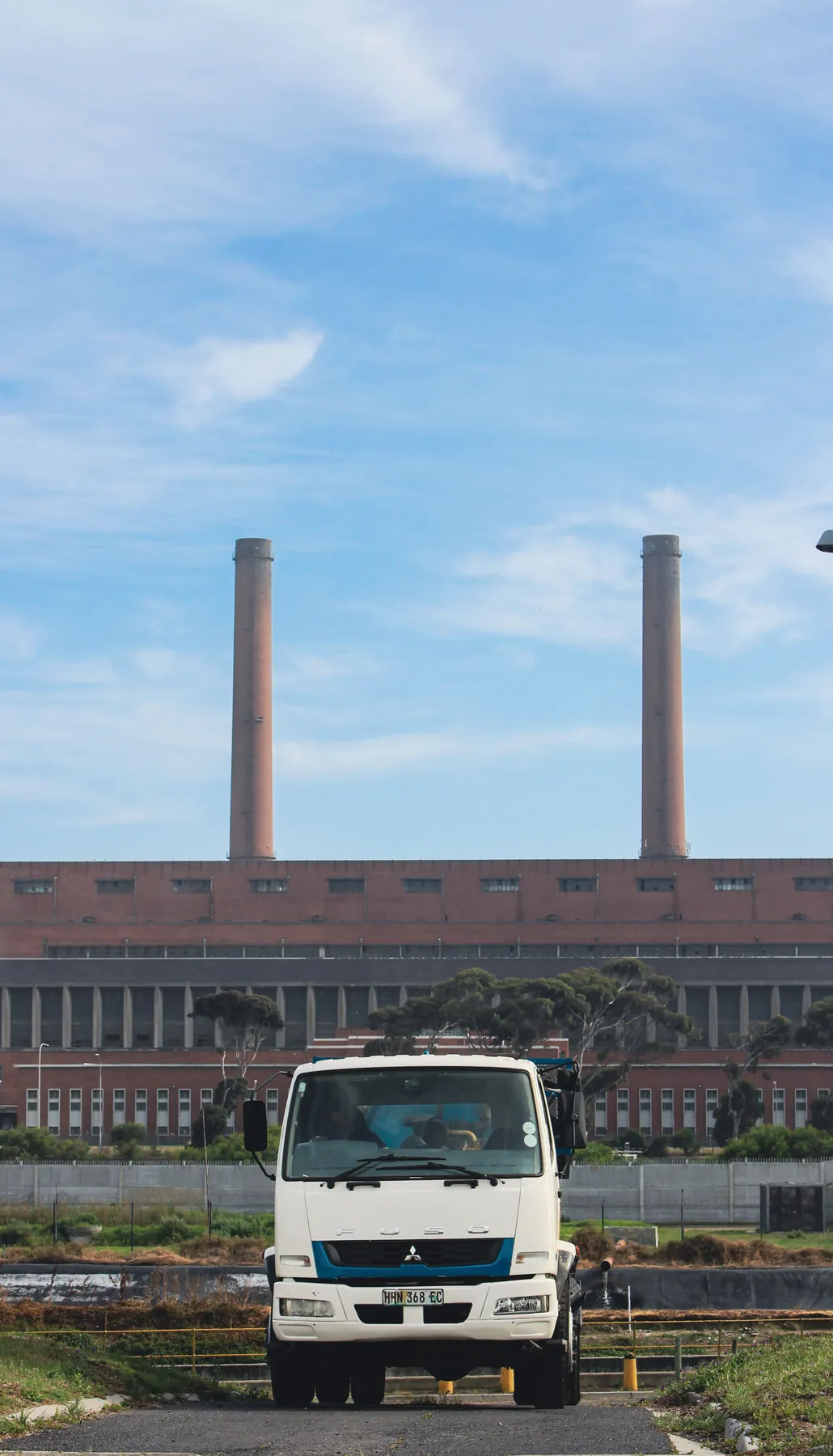 Ramatini tanker driving towards the camera with factory chimneys behind