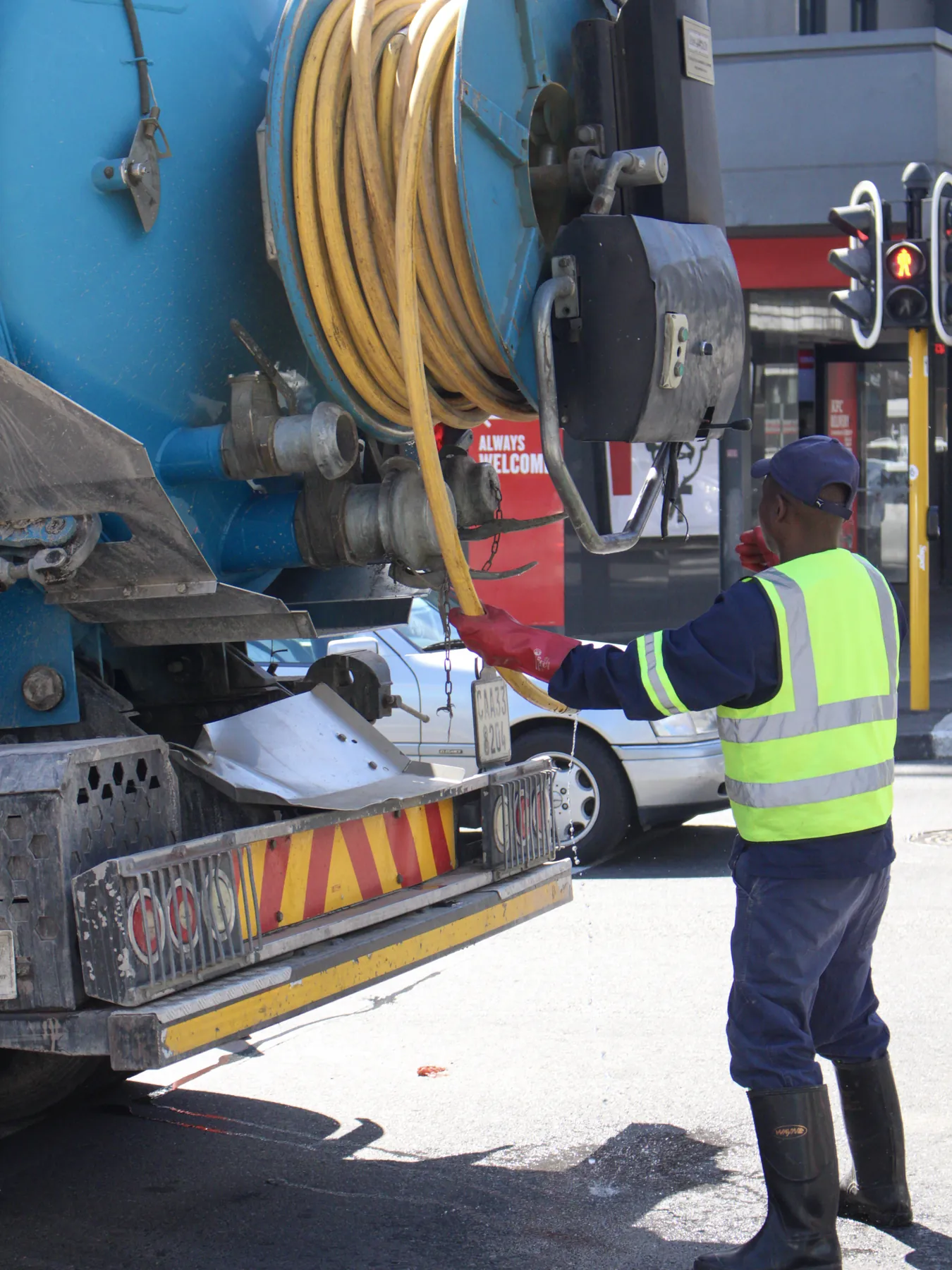 Ramatini operator working the jetting reel on a city street