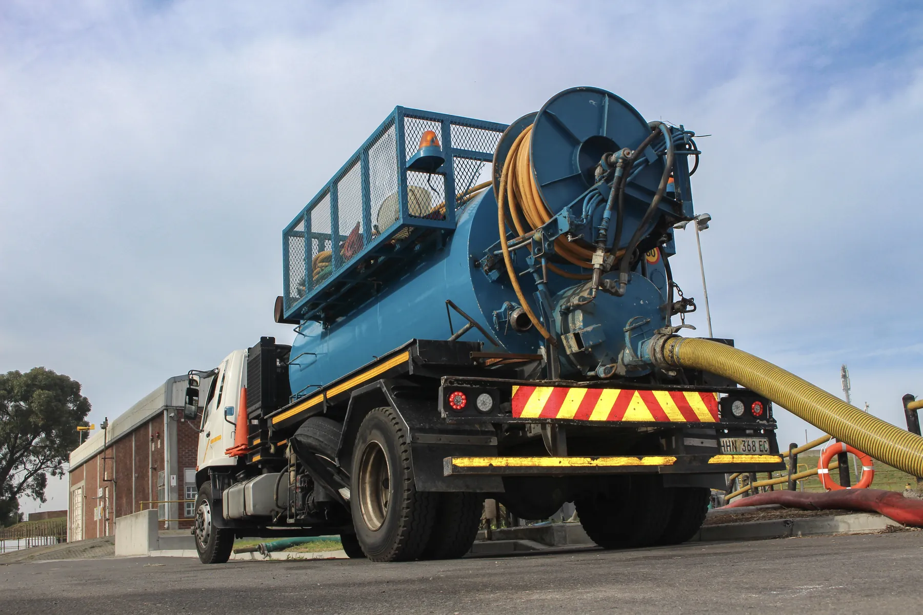 Ramatini vacuum tanker with its suction line run out on site