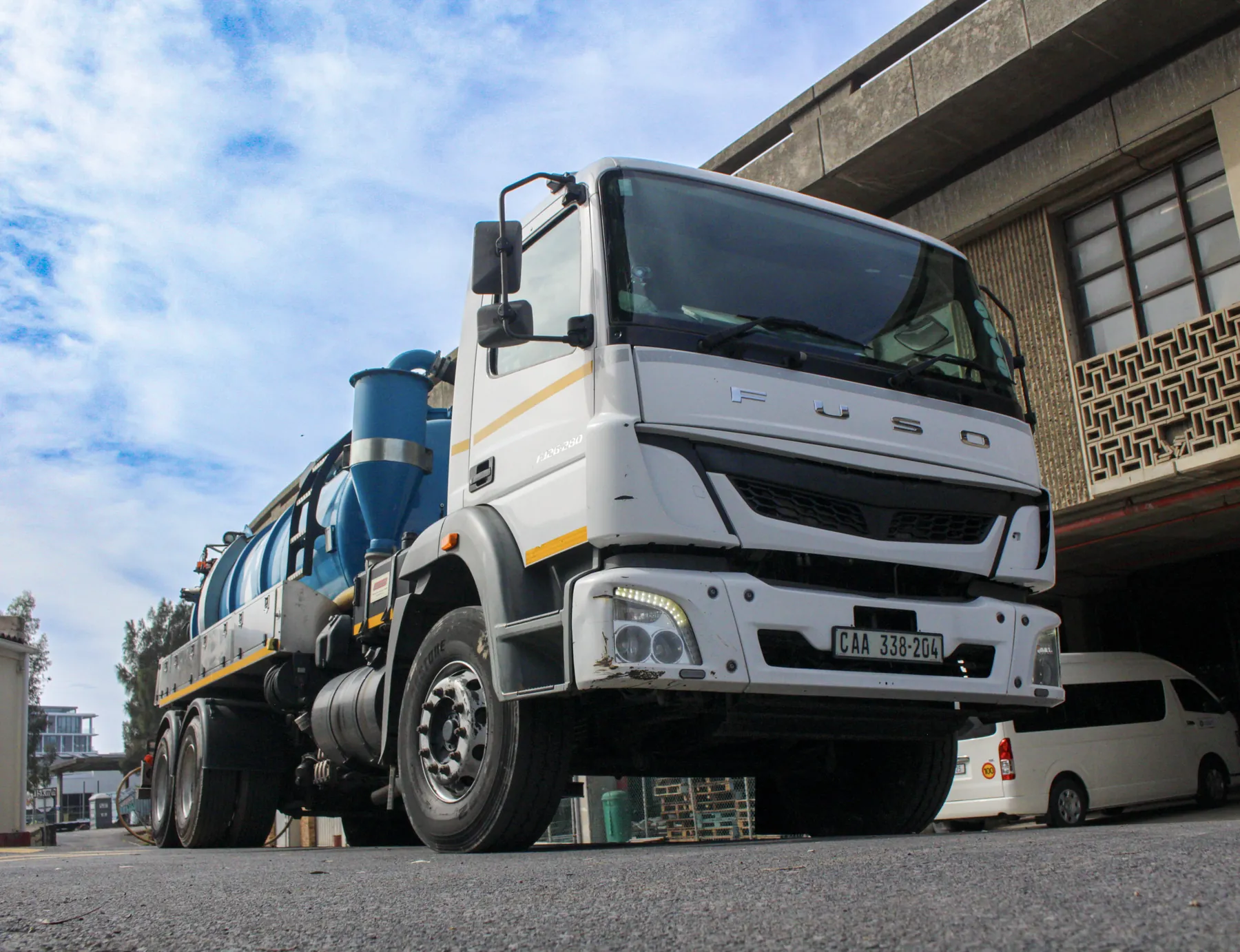 Ramatini vacuum tanker beside a depot building